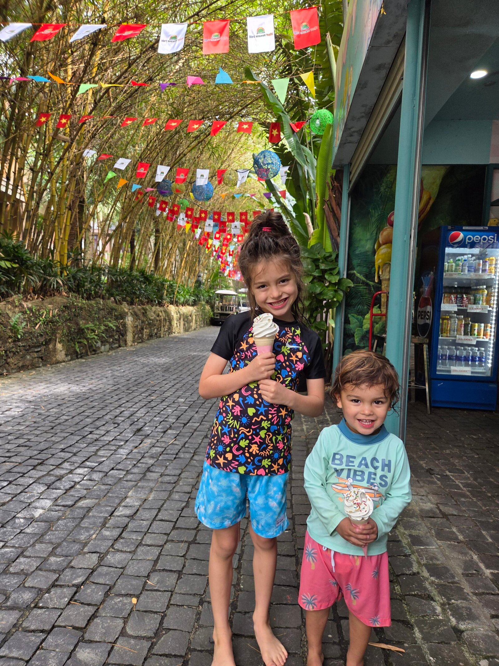 Kids eating ice cream at the hot springs waterpark in Da Nang Vietnam