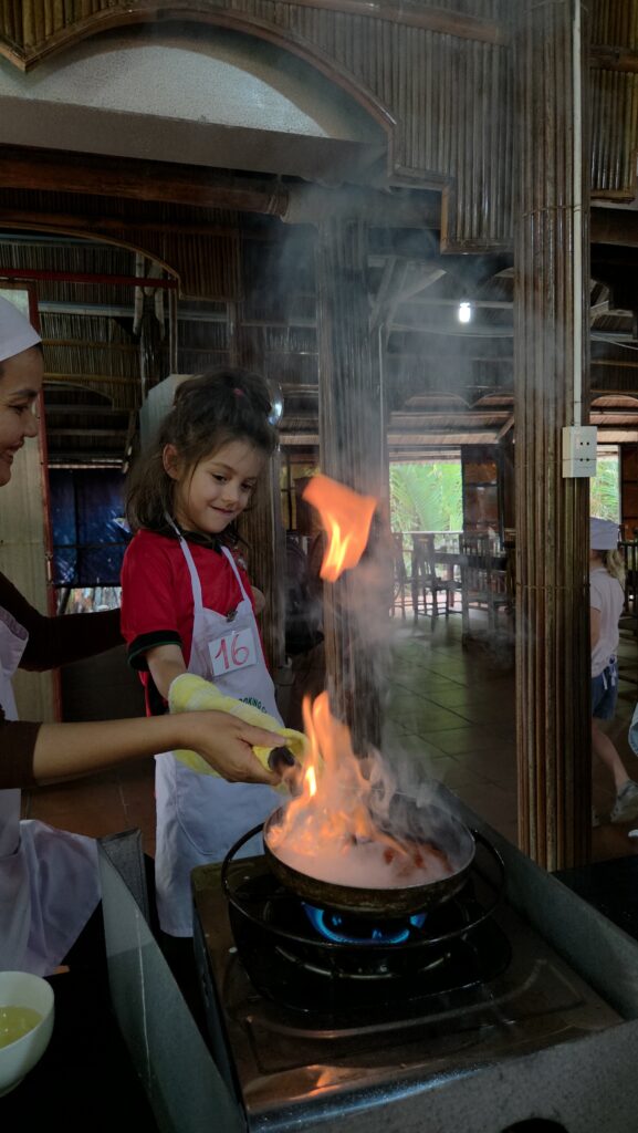 Kids cooking at a class in Hoi An 