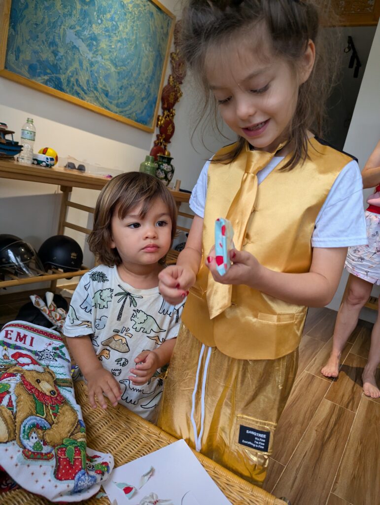 Kids opening presents while traveling in Vietname
